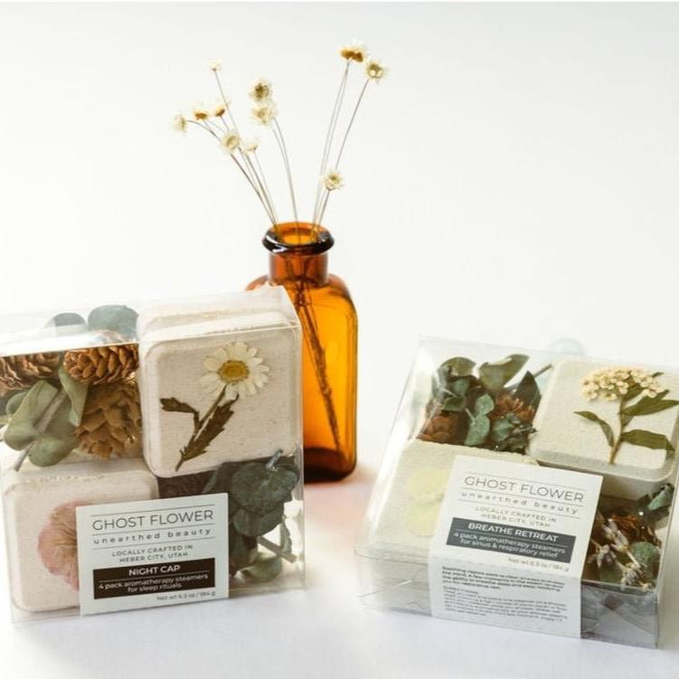 Two-different-packs-of-handmade-shower-steamer-aromas-with-pressed-flowers